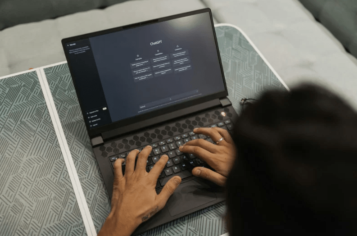Someone using ChatGPT on their laptop.
